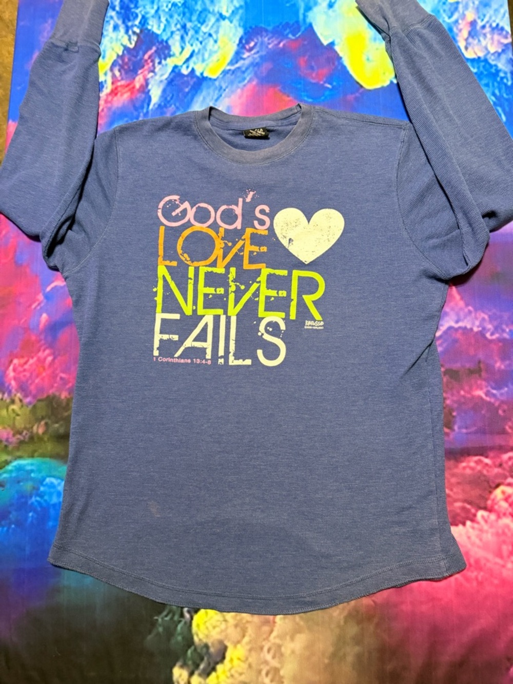 Women’s Blue Long Sleeve Tee – 'God’s Love Never Fails' Graphic